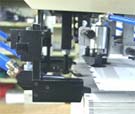 Rear edge sheet feeder in operation